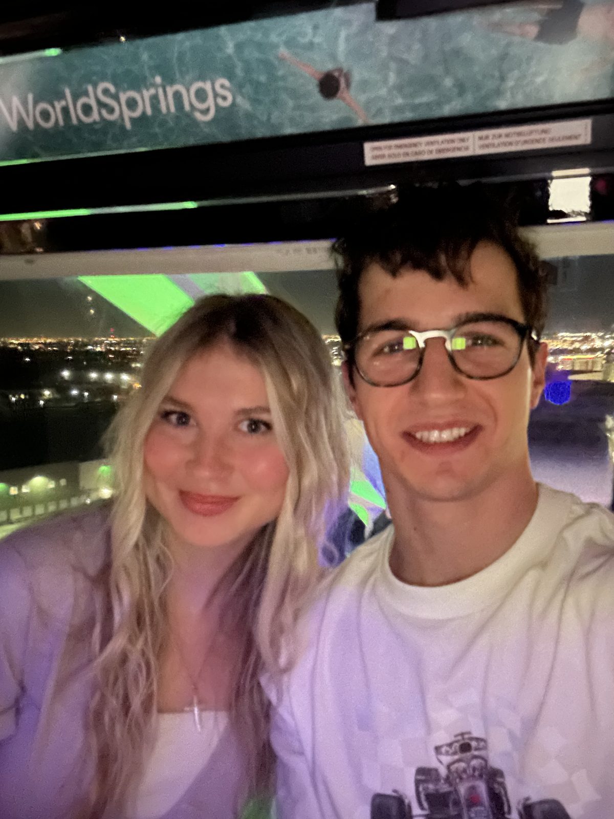 Simon and Francesca on a Ferris wheel at night