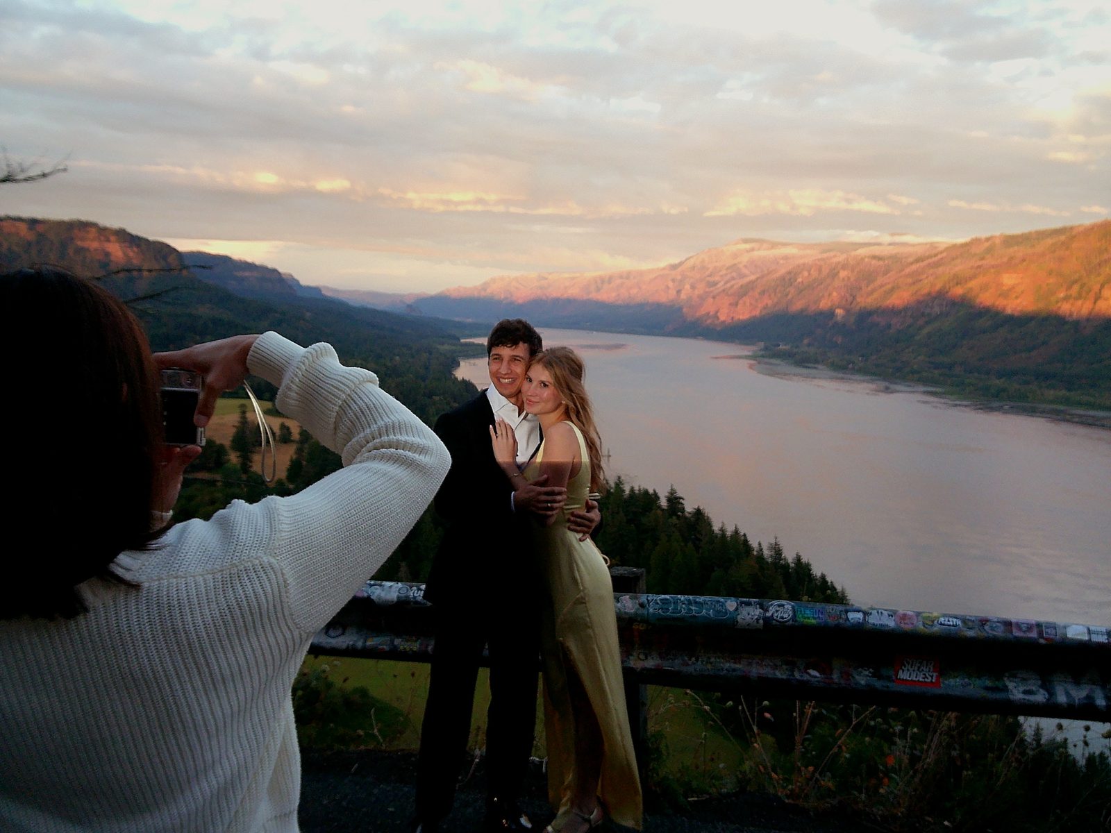 Simon and Francesca at a river overlook in Oregon at sunset